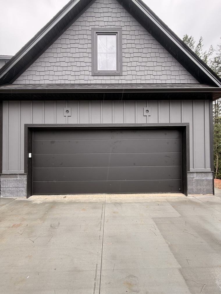 Matte black flush double door, front view — installed by Viking Garage Door, Upstate SC