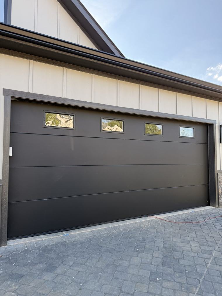 Matte black flush double door with four windows — installed by Viking Garage Door, Upstate SC